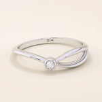 Minimalist 14k solid gold split band promise ring featuring a single small moissanite stone, designed for modern elegance and everyday wear.