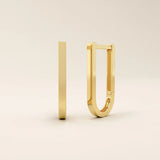 Minimalist U-shape hoop earrings in 14k yellow gold with a sleek modern finish.
