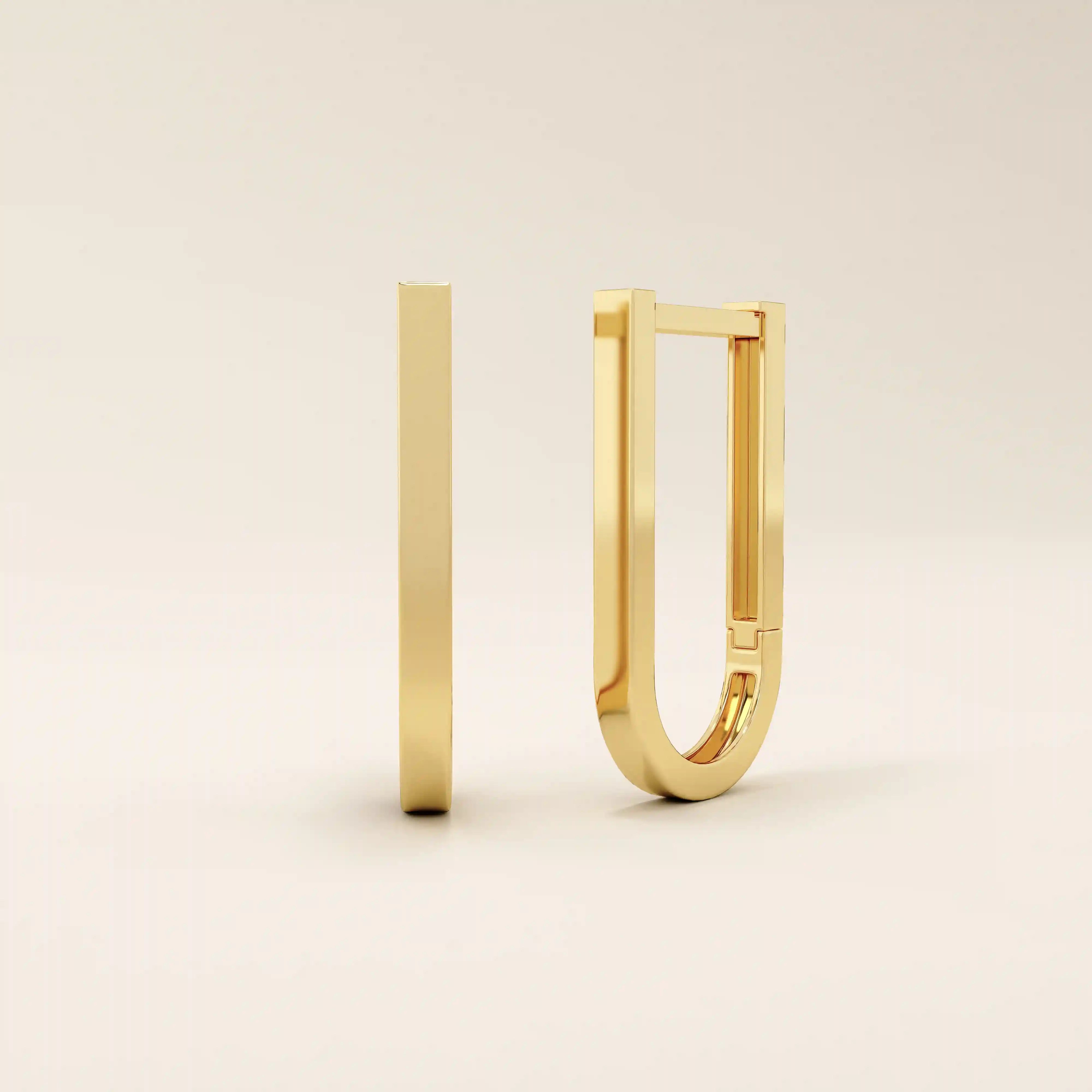 Minimalist U-shape hoop earrings in 14k yellow gold with a sleek modern finish.
