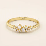 Minimalist cluster moissanite stacking wedding ring crafted in 14k solid gold, featuring a delicate round stone arrangement for timeless elegance.