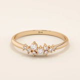 Minimalist cluster moissanite stacking wedding ring crafted in 14k solid gold, featuring a delicate round stone arrangement for timeless elegance.