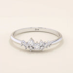 Minimalist cluster moissanite stacking wedding ring crafted in 14k solid gold, featuring a delicate round stone arrangement for timeless elegance.