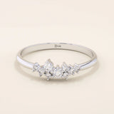 Minimalist cluster moissanite stacking wedding ring crafted in 14k solid gold, featuring a delicate round stone arrangement for timeless elegance.