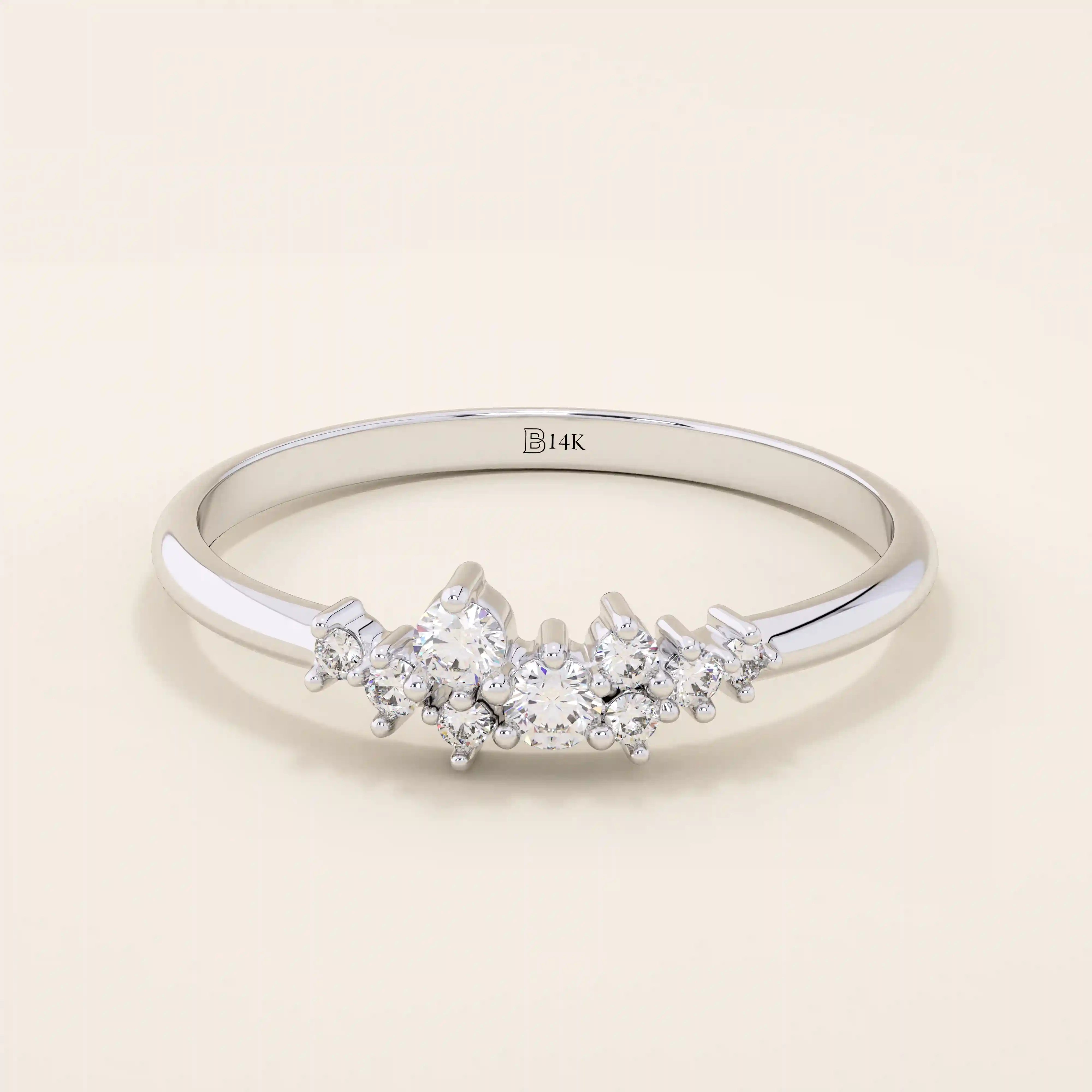 Minimalist cluster moissanite stacking wedding ring crafted in 14k solid gold, featuring a delicate round stone arrangement for timeless elegance.