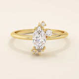 Minimalist solitaire engagement ring in 14k solid gold featuring a marquise-cut moissanite. Sleek and elegant design for modern brides.