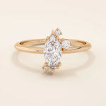 Minimalist solitaire engagement ring in 14k solid gold featuring a marquise-cut moissanite. Sleek and elegant design for modern brides.