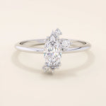 Minimalist solitaire engagement ring in 14k solid gold featuring a marquise-cut moissanite. Sleek and elegant design for modern brides.