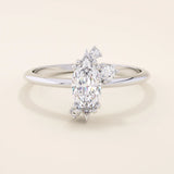 Minimalist solitaire engagement ring in 14k solid gold featuring a marquise-cut moissanite. Sleek and elegant design for modern brides.