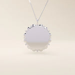 Minimalist sun-shaped necklace in 14k solid gold with a smooth, engravable surface. A timeless everyday piece perfect for personalization and gifting.