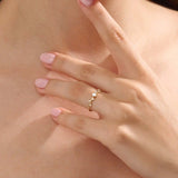 Model wearing a 14k solid gold minimalist solo promise ring, highlighting its simple yet elegant design for a modern, everyday look.