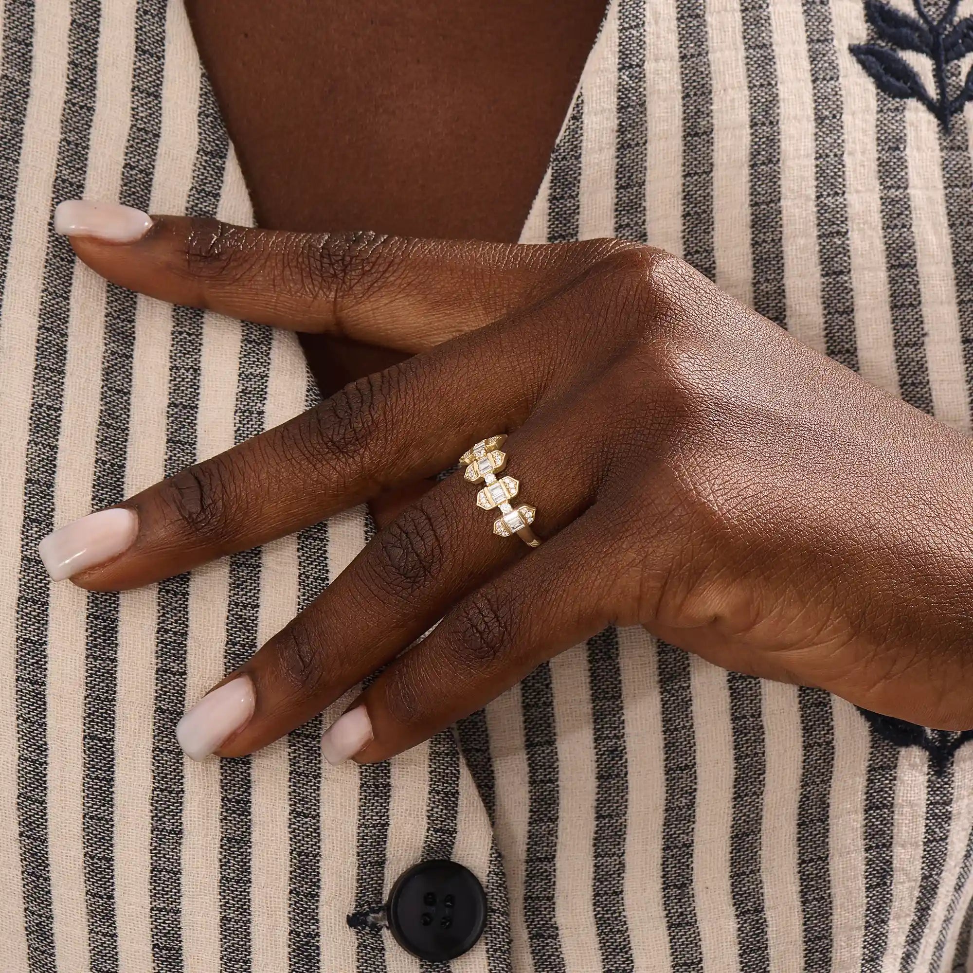 Model wears a 14k gold bold baguette spike statement ring. A distinctive and edgy accessory perfect for modern women.