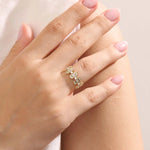 Model wears a 14k gold bold baguette spike statement ring. A distinctive and edgy accessory perfect for modern women.