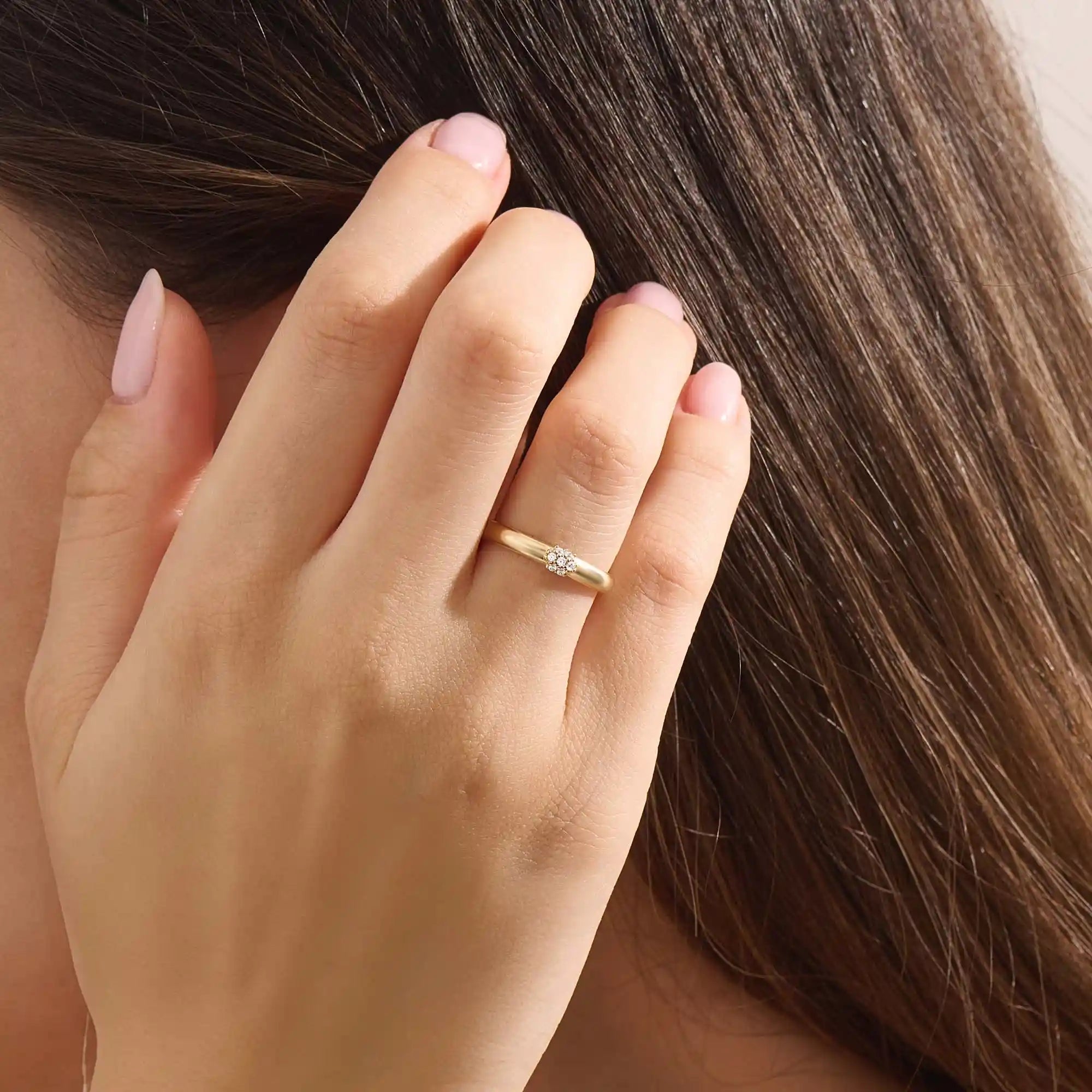 Model wears a 14k gold cluster moissanite wedding band promise ring. A stunning and timeless piece perfect for daily wear or special occasions.
