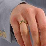 Model wears a 14k gold curve nesting ring with a marquise-cut emerald gemstone. Perfect for stacking or as a subtle statement piece.