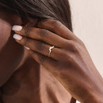 Model wears a 14k gold curved nesting ring adorned with clustered moissanites. Perfect for layering or wearing alone for subtle sparkle.