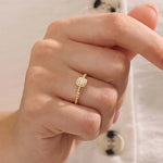 Model wears a 14k gold square pinky signet ring featuring a detailed beaded band. A sleek accessory perfect for layering or solo wear.