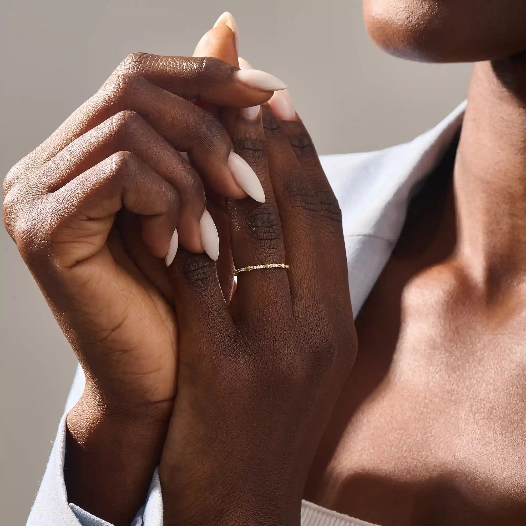 Model wears a 14k solid gold ultra-slim eternity spike stacking ring. Perfect for minimalist stacking and daily style.