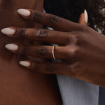 Model wears a 14k solid gold ultra-slim eternity spike stacking ring. Perfect for minimalist stacking and daily style.