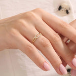 Model wears a bold pavé chain ring in 14k gold, featuring sparkling moissanites. A striking and glamorous addition to any jewelry stack.