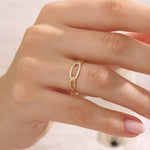 Model wears a bold pavé chain ring in 14k gold, featuring sparkling moissanites. A striking and glamorous addition to any jewelry stack.