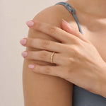 Model wears a vintage design 14k gold leaf band promise ring featuring detailed leaf engravings. Perfect for meaningful everyday wear or gifting.