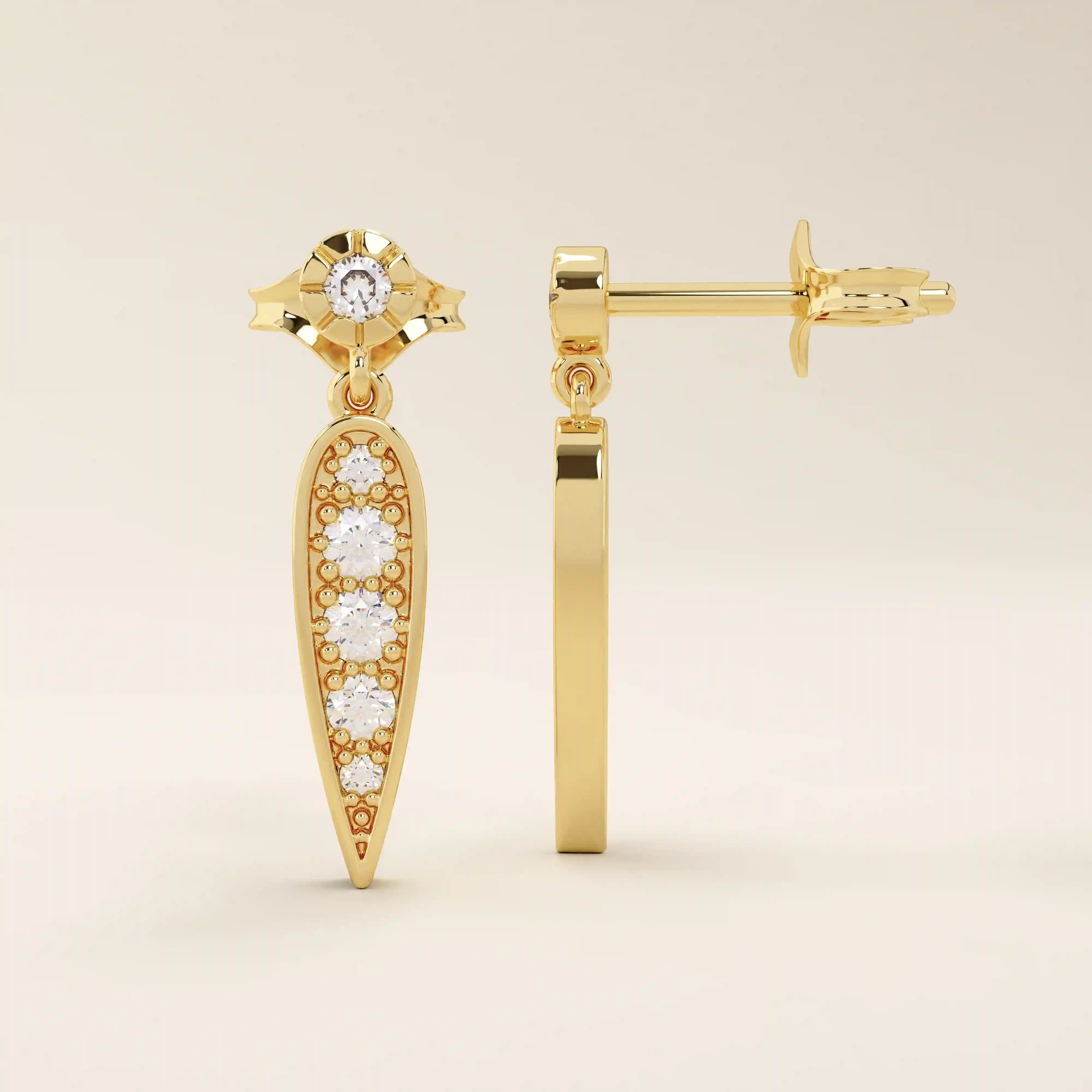 Nature-inspired dangling leaf stud earrings in 14k solid gold. Delicate and lightweight design perfect for everyday elegance.