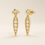 Nature-inspired dangling leaf stud earrings in 14k solid gold. Delicate and lightweight design perfect for everyday elegance.