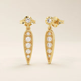 Nature-inspired dangling leaf stud earrings in 14k solid gold. Delicate and lightweight design perfect for everyday elegance.