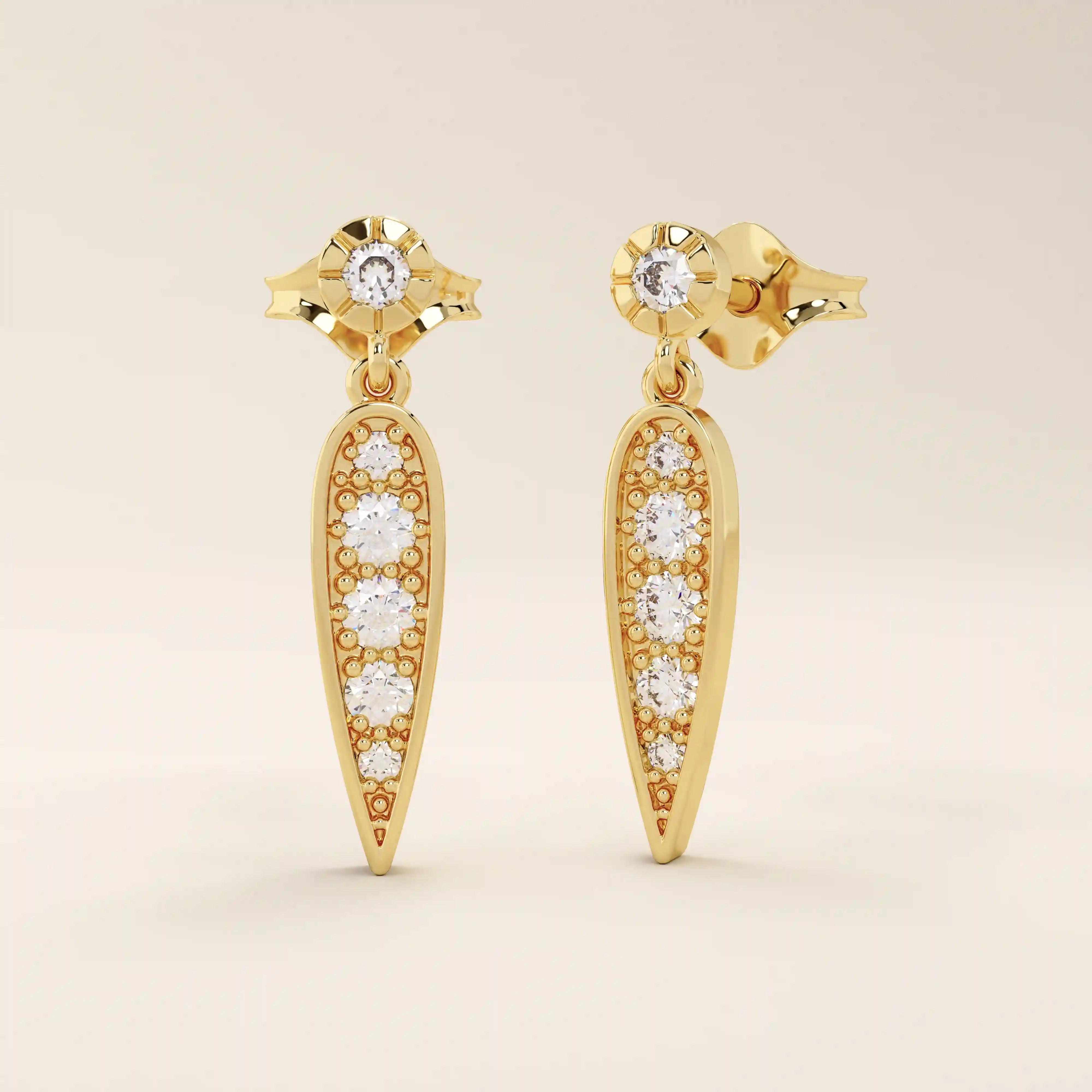 Nature-inspired dangling leaf stud earrings in 14k solid gold. Delicate and lightweight design perfect for everyday elegance.