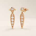 Nature-inspired dangling leaf stud earrings in 14k solid gold. Delicate and lightweight design perfect for everyday elegance.