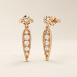 Nature-inspired dangling leaf stud earrings in 14k solid gold. Delicate and lightweight design perfect for everyday elegance.
