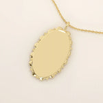 Oval-shaped 14k solid gold necklace with a smooth, plain surface, perfect for engraving. A minimalist and timeless jewelry piece.