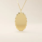 Oval-shaped 14k solid gold necklace with a smooth, plain surface, perfect for engraving. A minimalist and timeless jewelry piece.