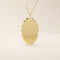 Oval-shaped 14k solid gold necklace with a smooth, plain surface, perfect for engraving. A minimalist and timeless jewelry piece.