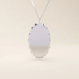 Oval-shaped 14k solid gold necklace with a smooth, plain surface, perfect for engraving. A minimalist and timeless jewelry piece.