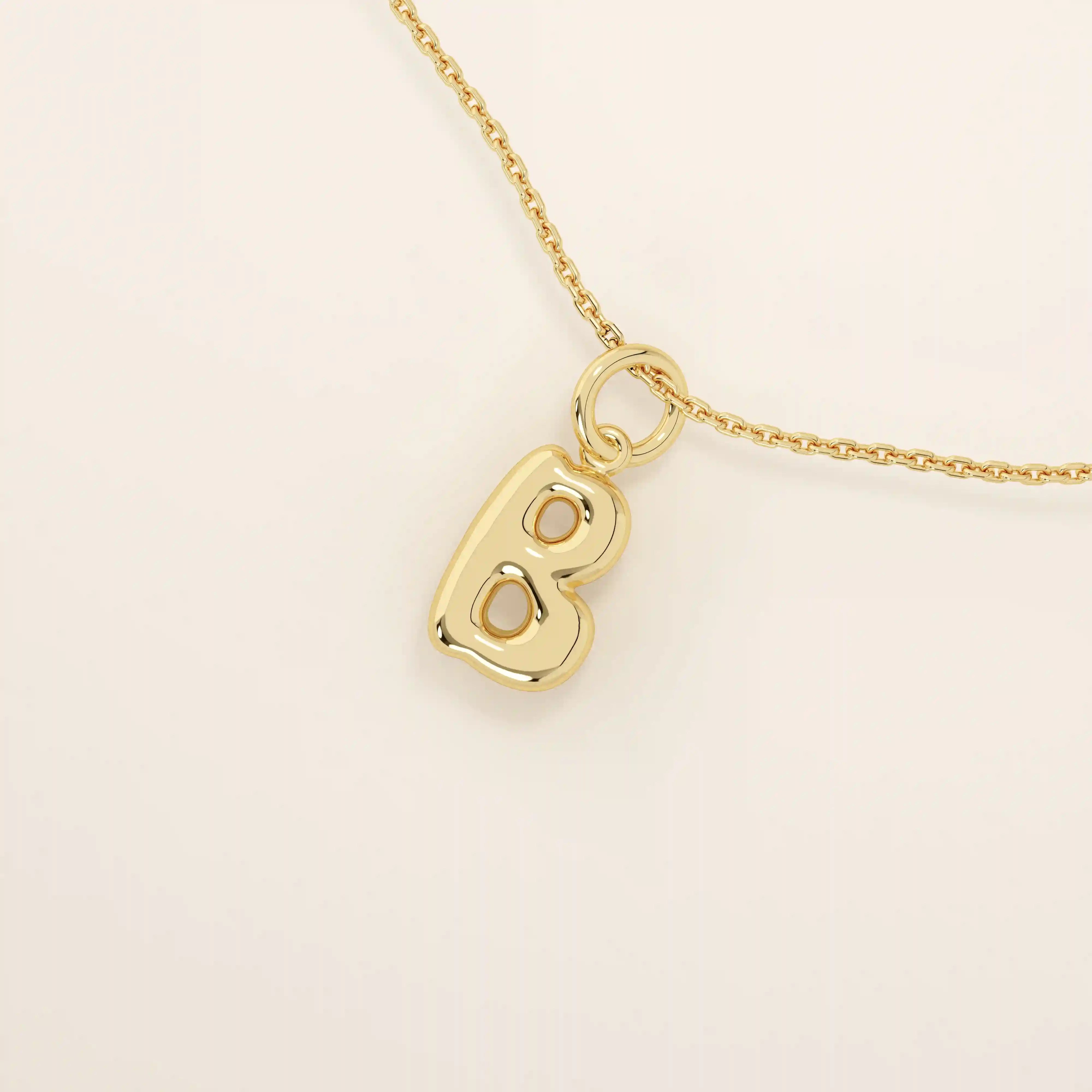 Puffy initial letter necklace crafted in 14k solid gold with a soft, dimensional finish. A modern personalized piece ideal for everyday layering.
