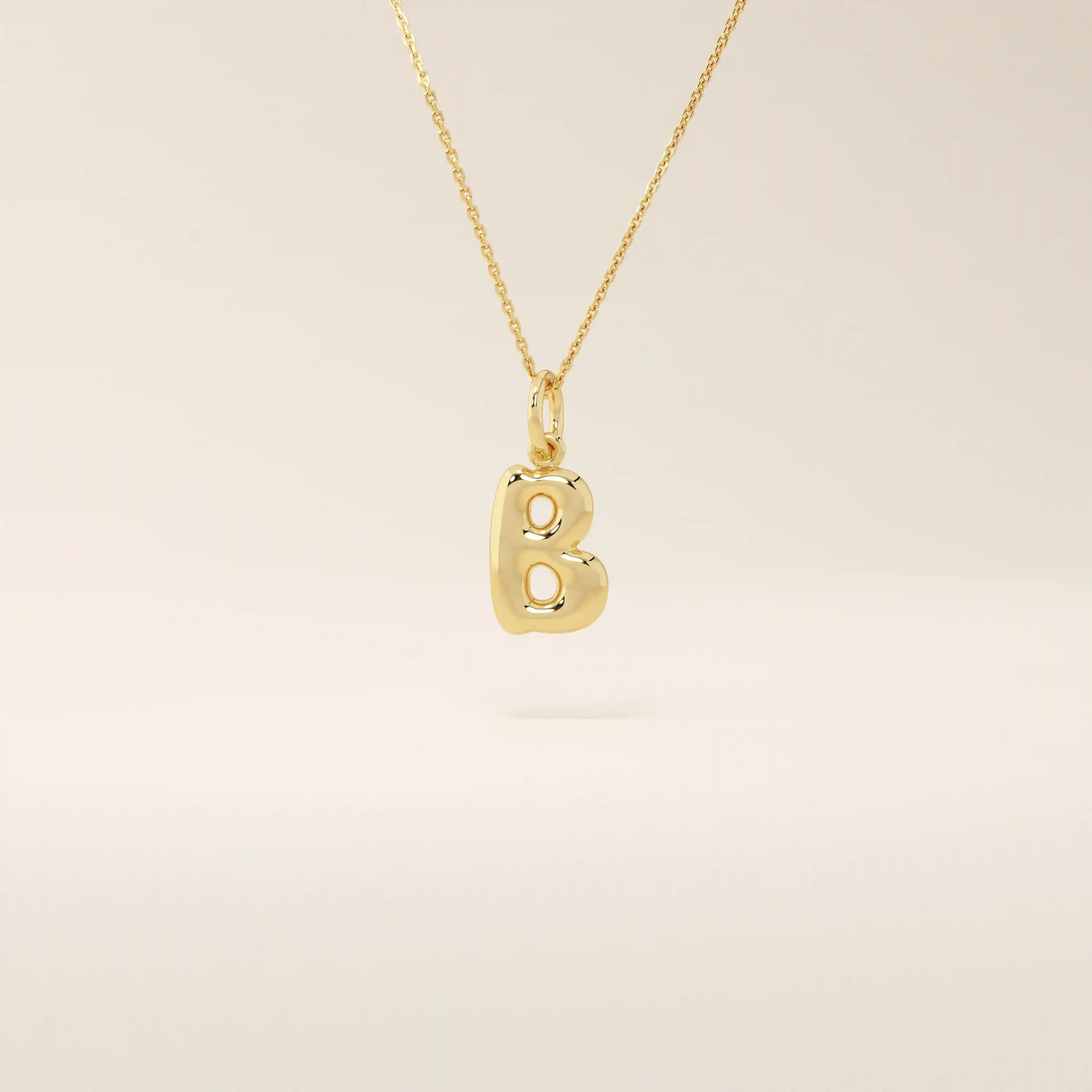 Puffy initial letter necklace crafted in 14k solid gold with a soft, dimensional finish. A modern personalized piece ideal for everyday layering.