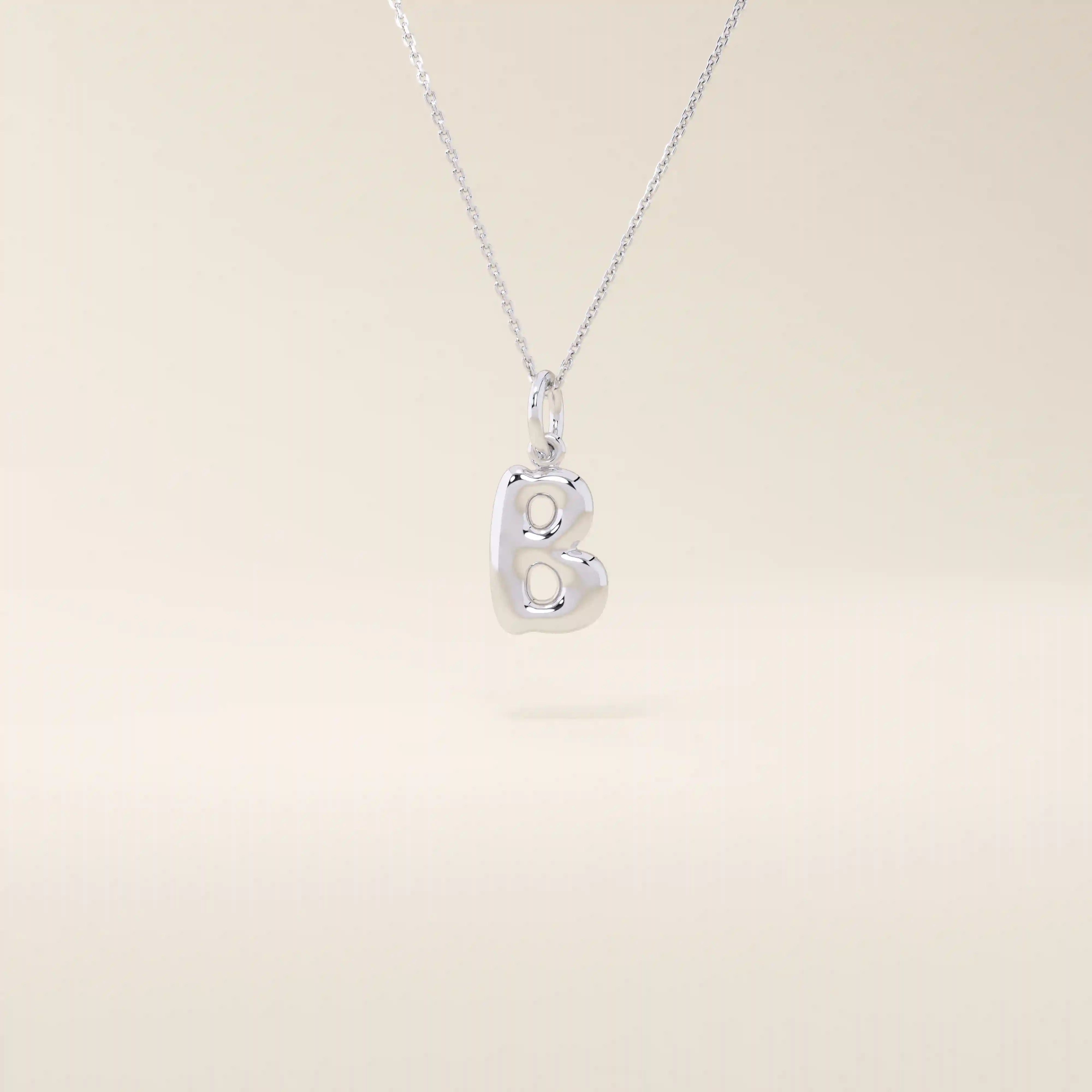 Puffy initial letter necklace crafted in 14k solid gold with a soft, dimensional finish. A modern personalized piece ideal for everyday layering.