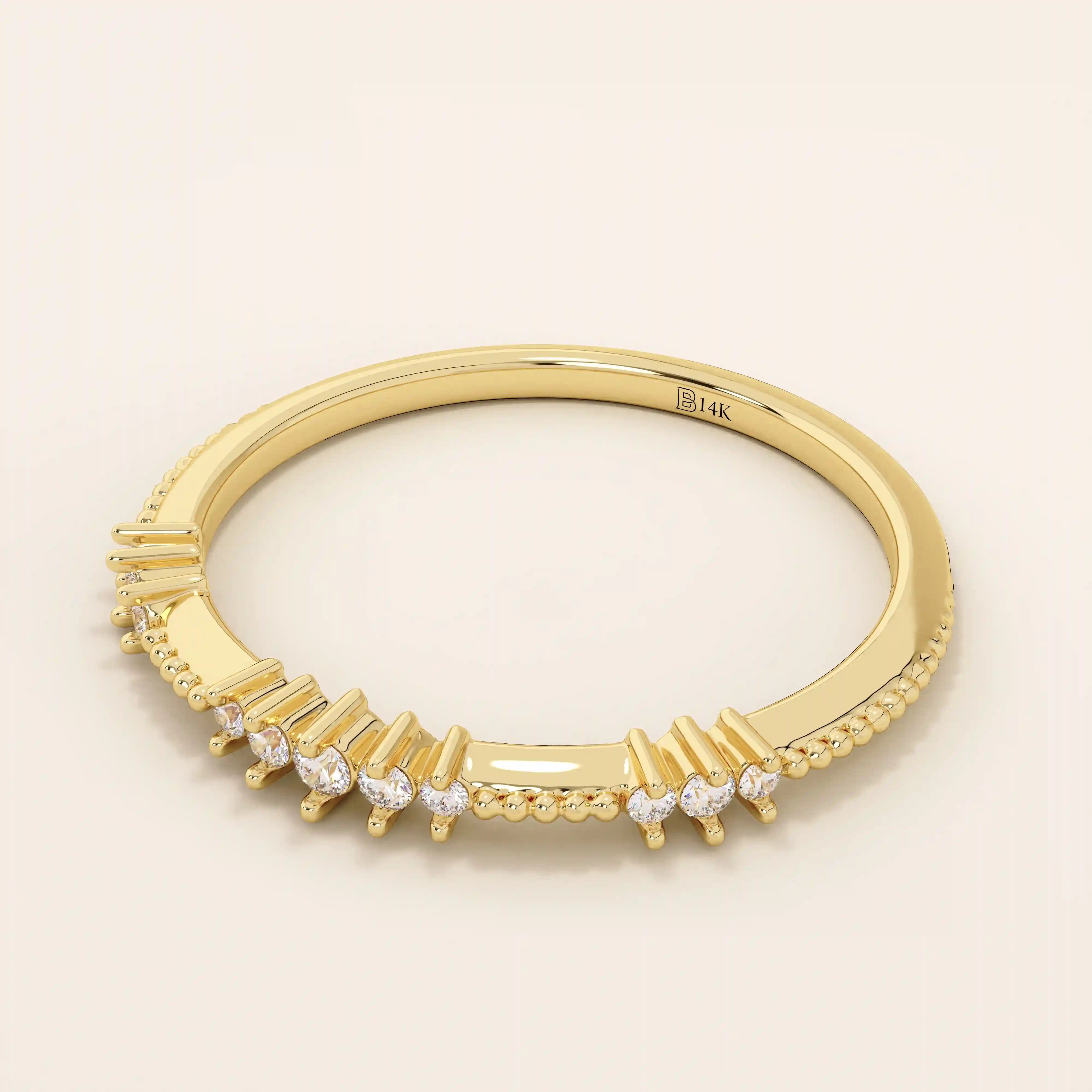 Side angle view of a 14k solid yellow gold band with round brilliant cut moissanite stones in alternating prong and bead settings, elegant stacking or wedding ring

