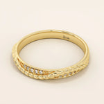 Side angle view of a 14k solid yellow gold braided wedding band with a row of round brilliant diamonds, classic and versatile design

