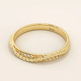 Side angle view of a 14k solid yellow gold braided wedding band with a row of round brilliant diamonds, classic and versatile design
