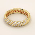 Side angle view of a 14k solid yellow gold dome band with rows of pavé set round brilliant cut moissanite stones, sophisticated and glamorous bridal jewelry

