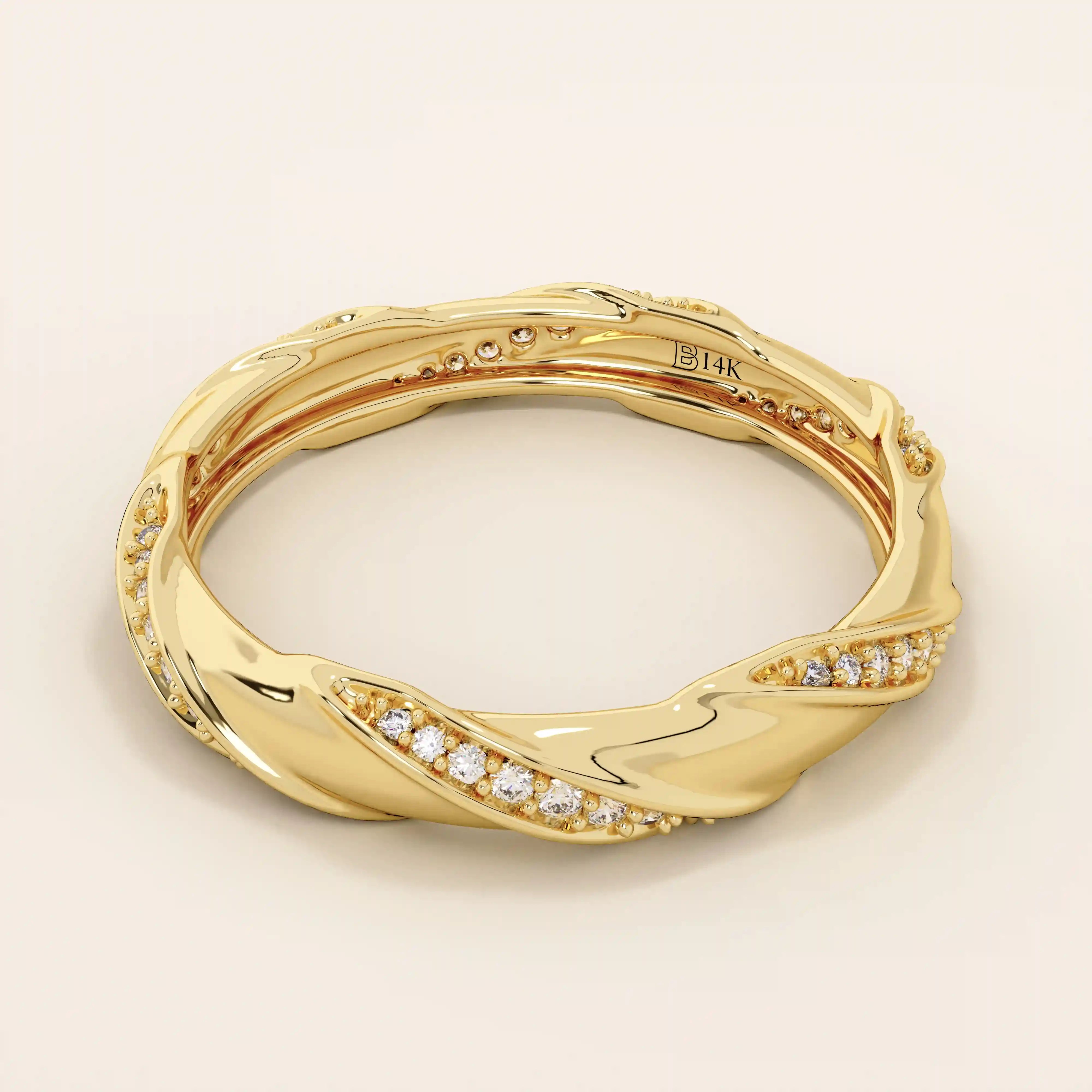 Side angle view of a 14k solid yellow gold twist eternity wedding band with rows of sparkling moissanites in an elegant sculpted design
