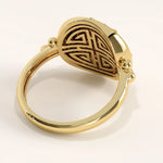 Side view of 14k gold vermeil boho sun ring showcasing its raised sun motif and beaded band details with polished reflective finish.
