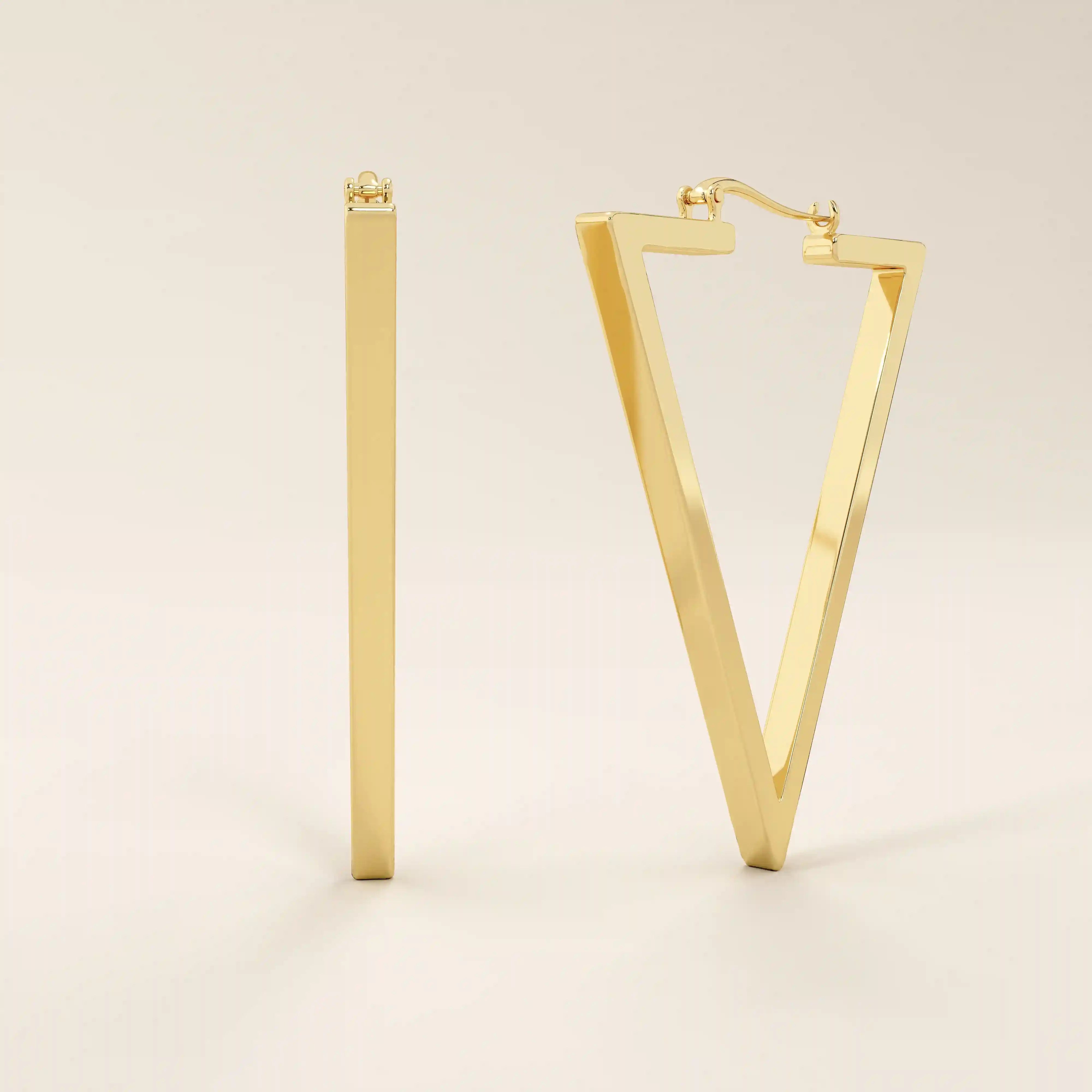 Side view of 14k solid yellow gold geometric triangle hoop earrings, showing their slim, flat profile and high-polish finish.
