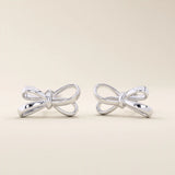 Simple ribbon stud earrings in 14k white gold, crafted in a delicate bow shape.
