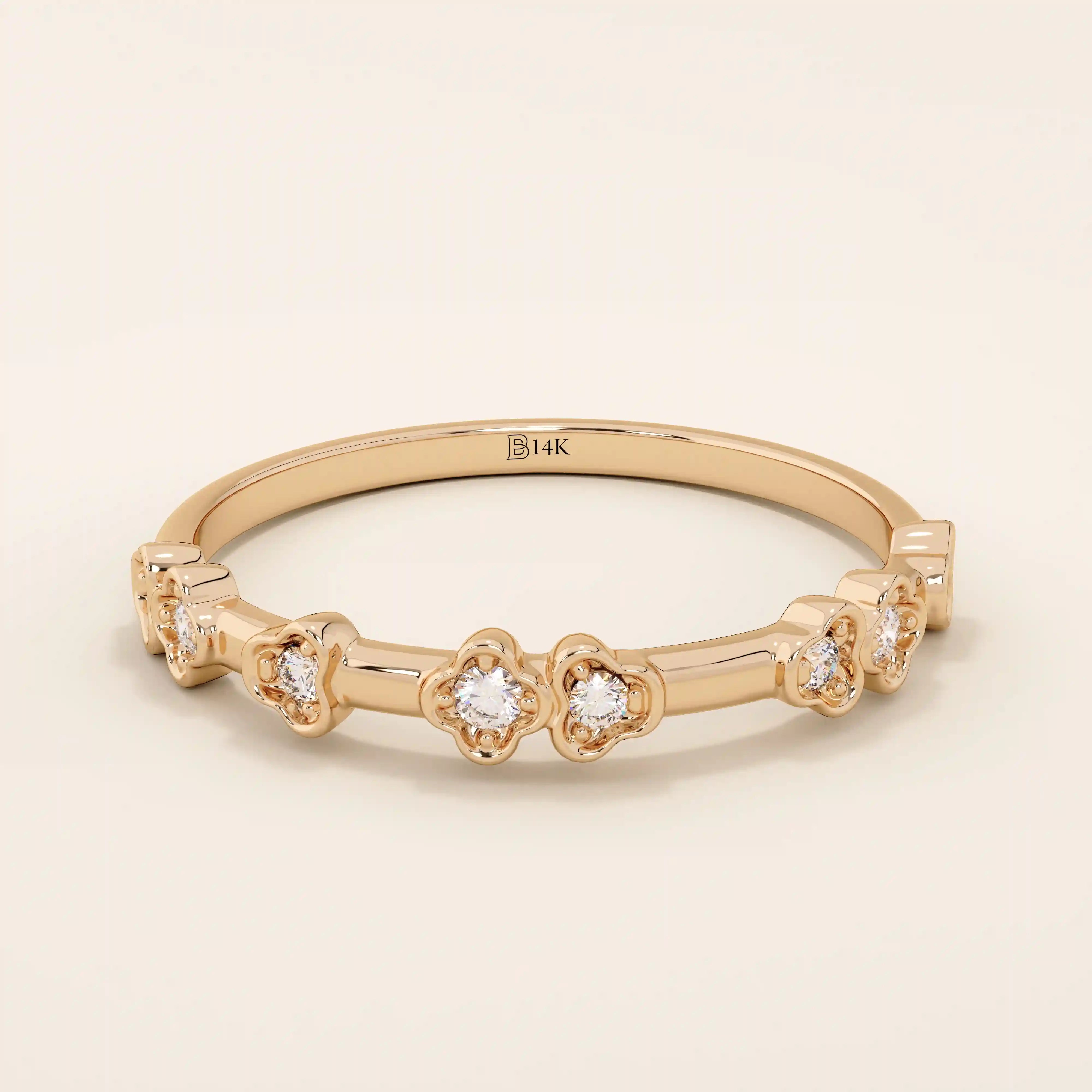 Slim 14k solid gold stacking ring with tiny flower motifs, minimalist and feminine jewelry design for everyday wear.