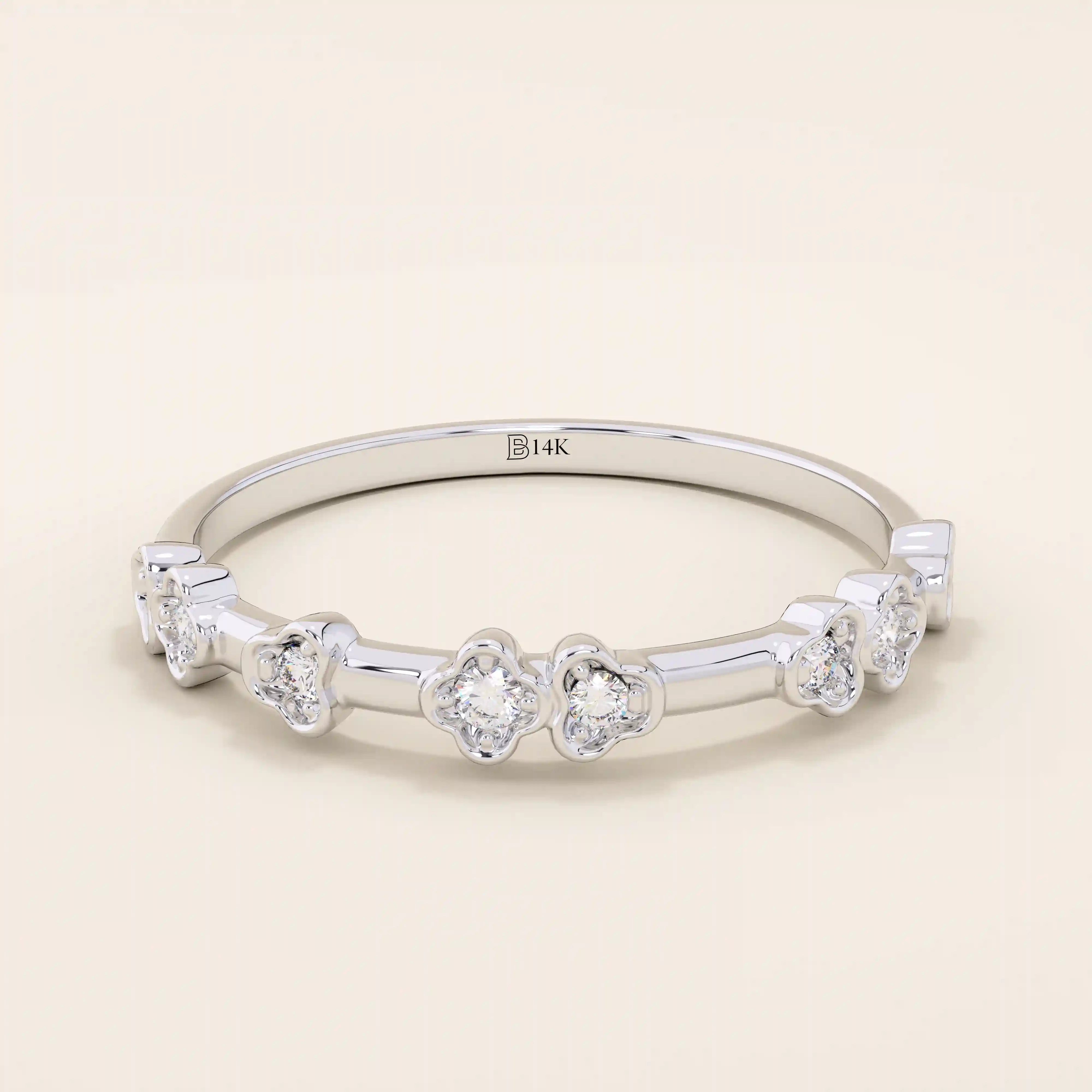 Slim 14k solid gold stacking ring with tiny flower motifs, minimalist and feminine jewelry design for everyday wear.