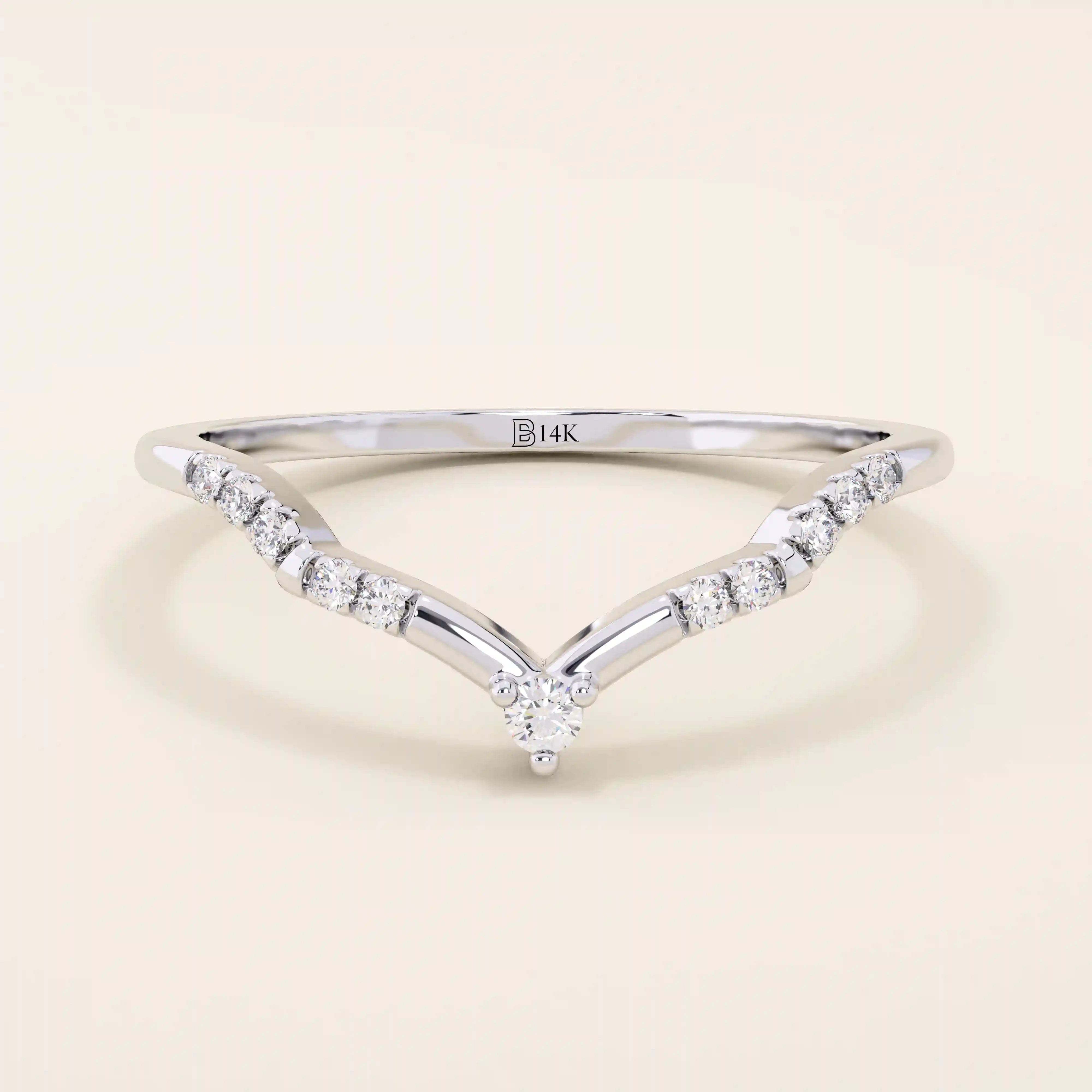 Slim chevron-shaped curve ring in 14k solid gold, accented with pavé moissanites. A delicate nesting band with modern lines and sparkle.