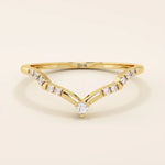 Slim chevron-shaped curve ring in 14k solid gold, accented with pavé moissanites. A delicate nesting band with modern lines and sparkle.